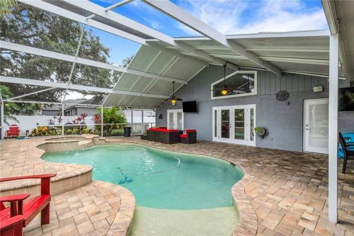 a pool in a house with patio